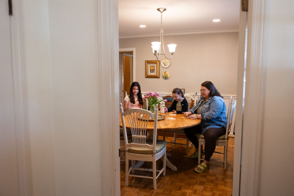 springtime family photo ideas in Raleigh - playing a game inside