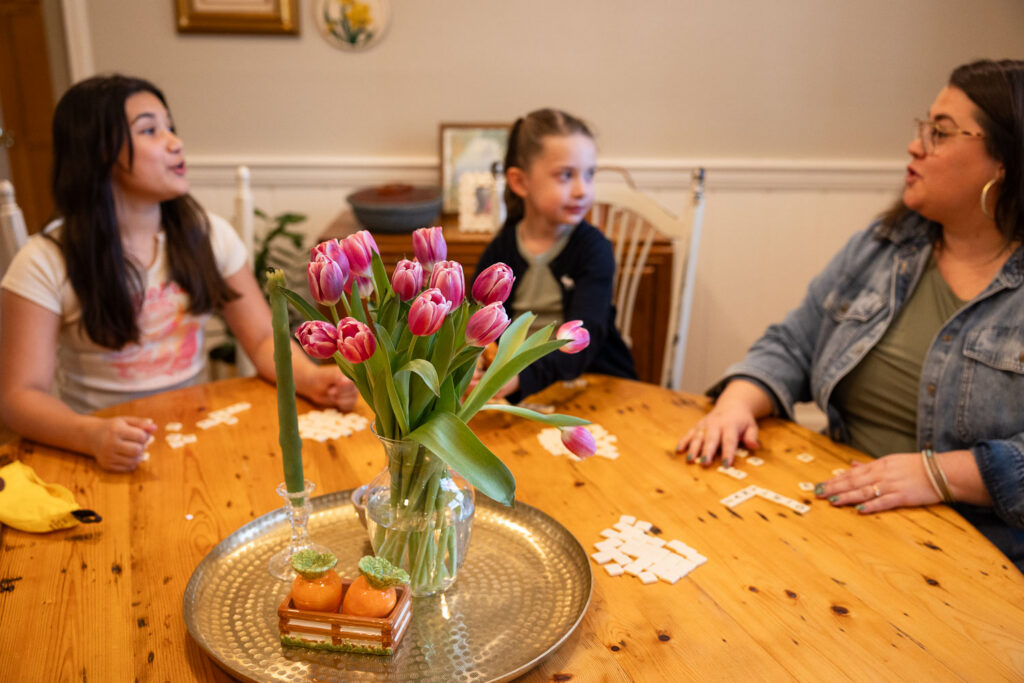 Candid family photos in Raleigh with tulips inside