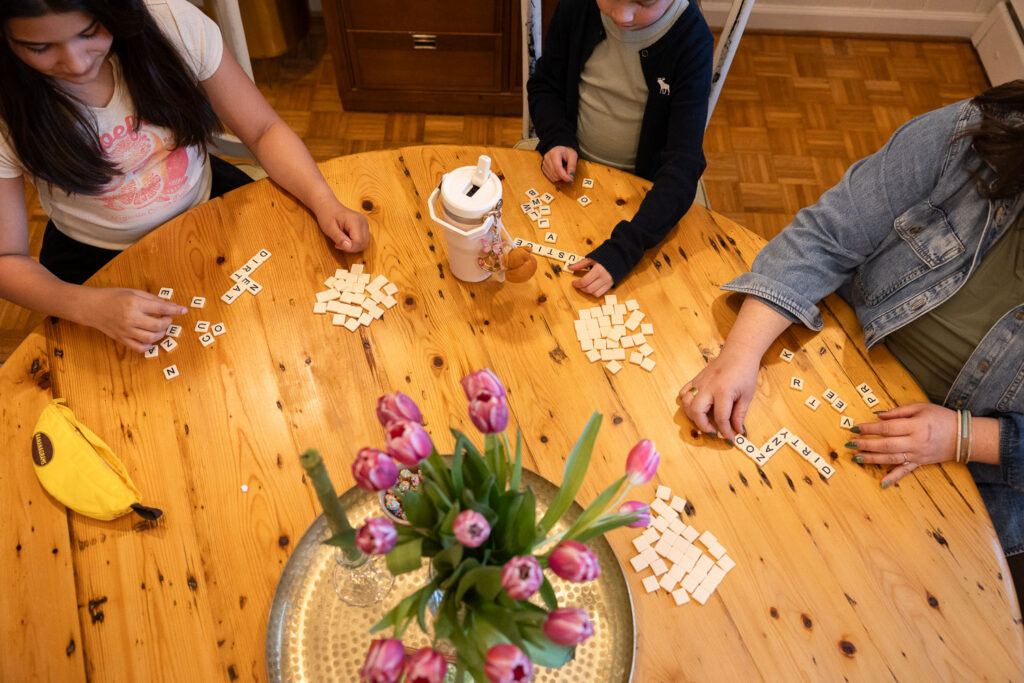 playing games at home for Raleigh candid family photos in the spring