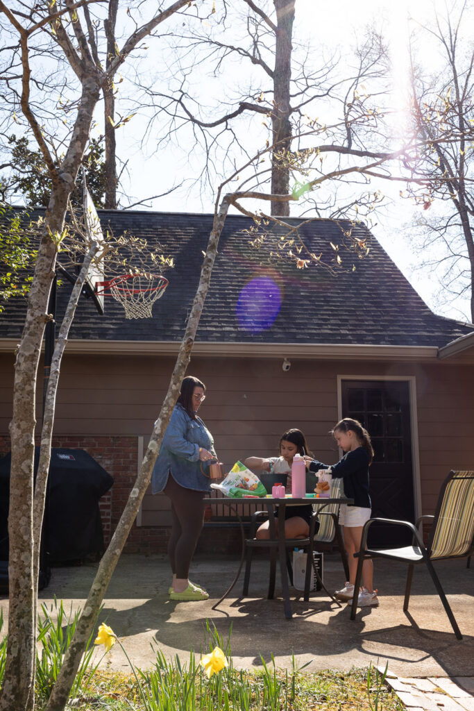 North Hills Raleigh springtime candid documentary family photos planting seeds and gardening in the backyard