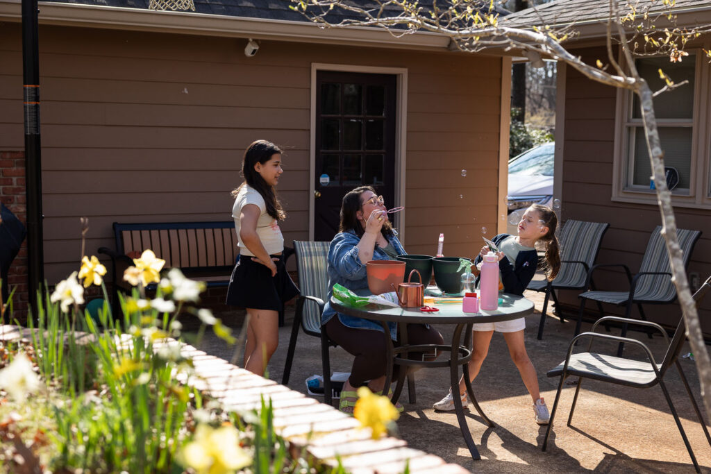 Raleigh mom playing with her daughters candid family photo session
