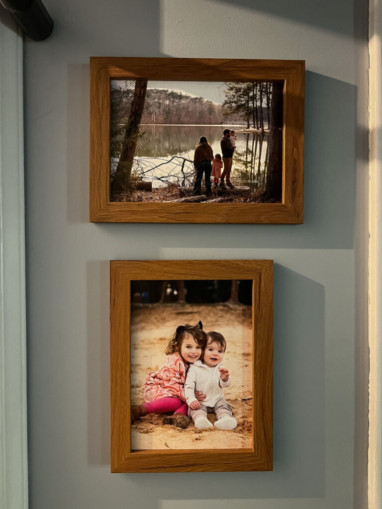 Framed photos in the family's home from the kids' New Life Collection photo sessions