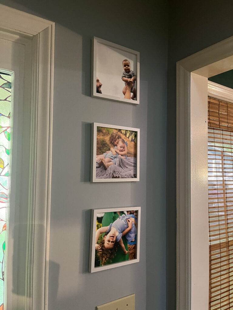 Framed photos in the family's home from the kids' New Life Collection photo sessions