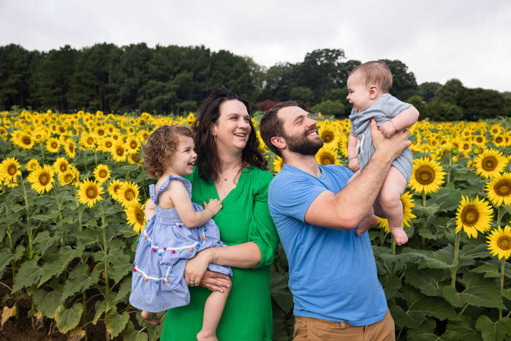Dorothea Dix Park sunflower field family photo session with toddler and 6-month-old baby