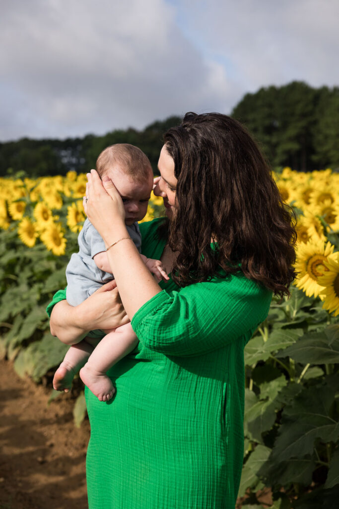 Mom and baby son photo session at Dix Park sunflower field