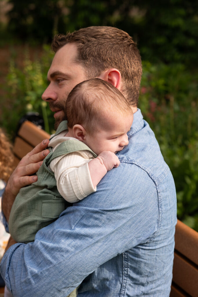 Mom holds 3-month-old baby at one of their baby's first year photo sessions
