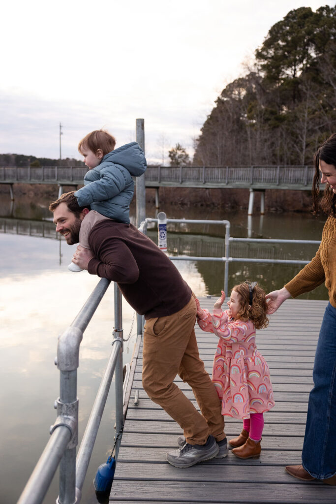 Family of four on Lake Johnson Raleigh dock