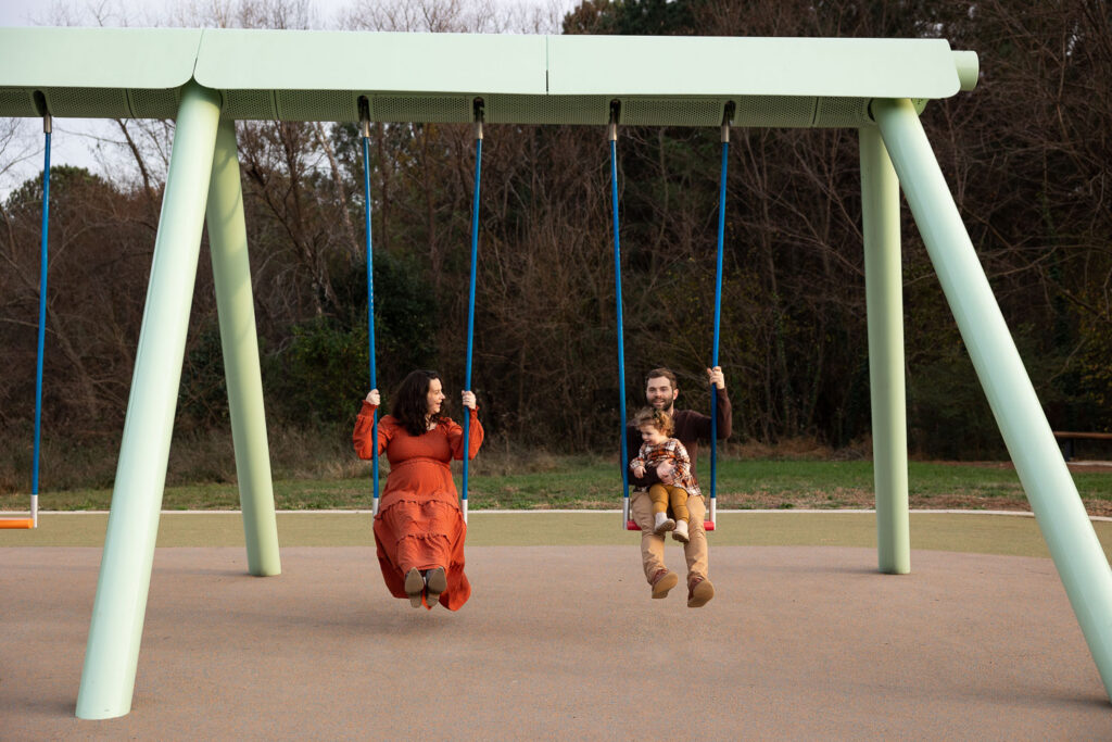 Raleigh maternity photos at NCMA musical swings