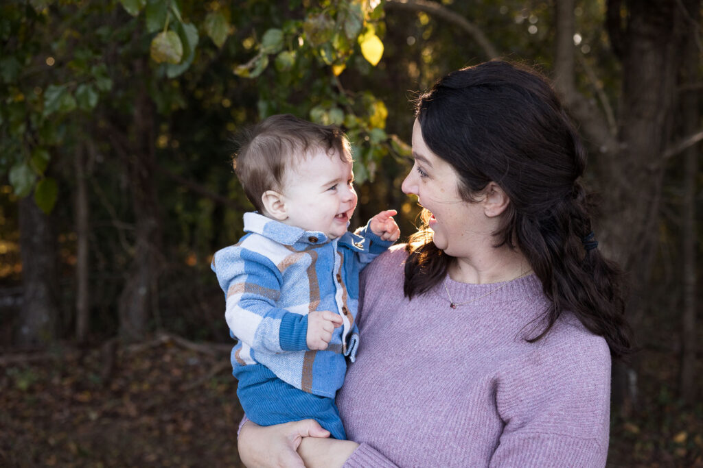 Mom and baby son look at each other smiling big at Prairie Ridge Ecostation 
