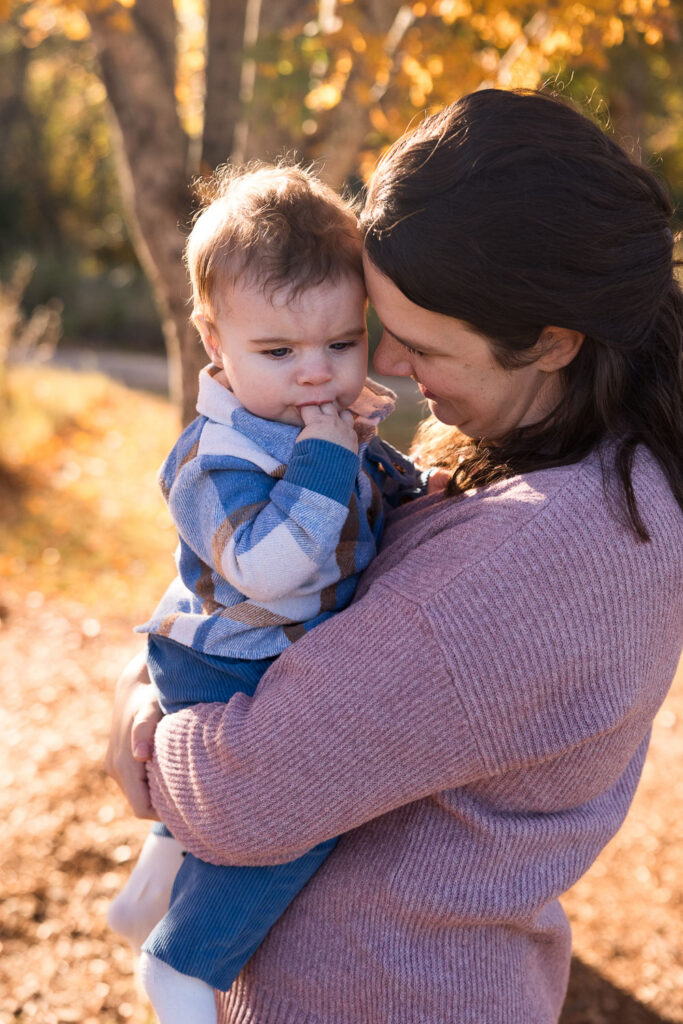 Tender photo of mom holding baby boy at Prairie Ridge Ecostation photo session